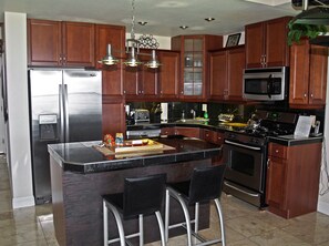 Another view of kitchen and island bar