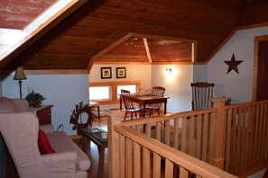 Attic sitting area with movies, games, and kids area