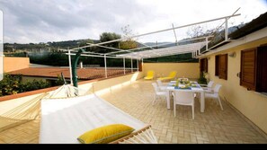 Large relax terrace with hammock, sunbeds and outside shower at Casa Mariandre A