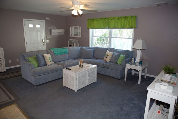 Spacious living room area. Games inside of coffee table