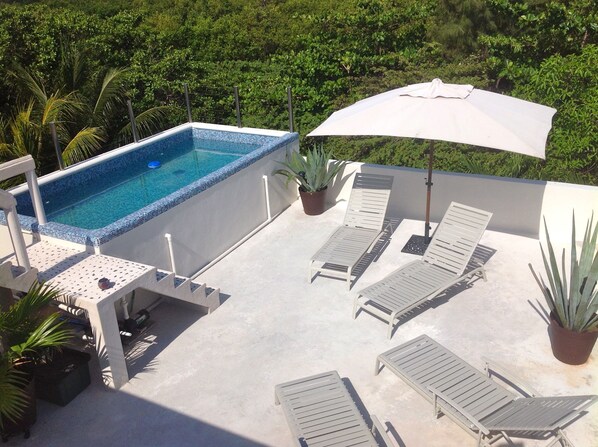 Float above the jungle or sunbathe with privacy on the rooftop terrace.
