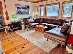 "Room and Board" Italian Leather sofa and 55 inch "Samsung Frame" smart TV.