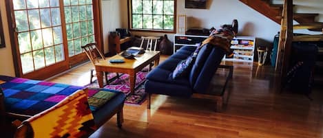 Living room of Chalet, overlooking hot tub and gloriousTomales Bay