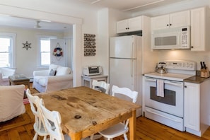 Kitchen with dining table - Refrigerator has ice maker