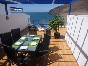 Large private terrace - perfect for dining - sun awning above the dining table.