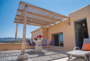 The terrace offers 180 degree countryside views and plenty of shade under the large wooden pergola