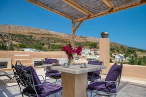 The terrace offers 180 degree countryside views and plenty of shade under the large wooden pergola