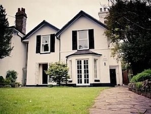 Front of the property and walled front garden.