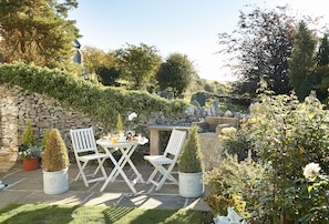 Stylish table and chairs perfect for a spot of sun on the patio