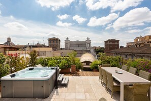 The rooftop garden has a Jacuzzi, a large siting area with tables and sofas