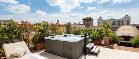 The rooftop garden has a Jacuzzi, a large siting area with tables and sofas