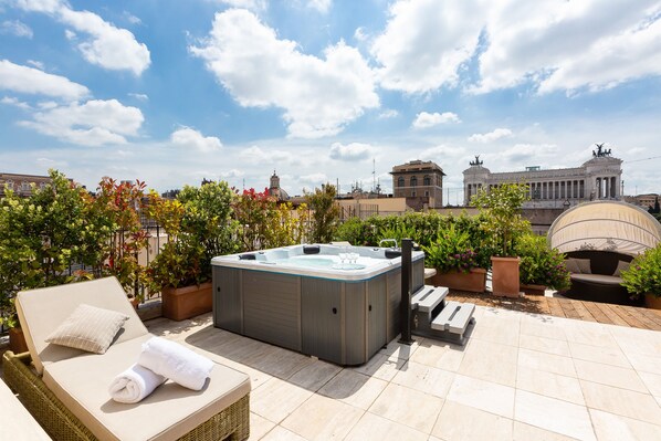 The rooftop garden has a Jacuzzi, a large siting area with tables and sofas