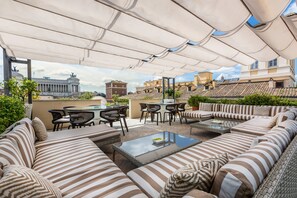 The rooftop garden has a Jacuzzi, a large siting area with tables and sofas