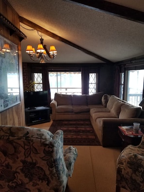 Living room with large windows to deck