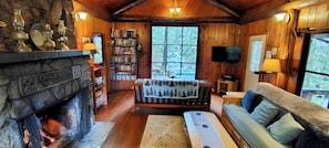 Cozy living room with fireplaces and inspiring views from every window.