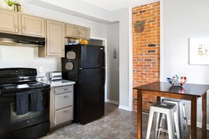 Kitchen with small table and seating for 2.