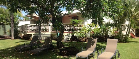 tropical private & serene garden on 1/2 acre w plantation home in background