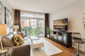 Living Room with balcony overlooking the courtyard.