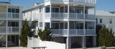 View of home from the beach. Elevated mid level is the living unit.