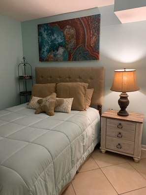 Relax in the  master bedroom with views of beautiful Little Lagoon. 