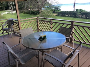 Relax on the deck and enjoy the view of lovely Anini Beach