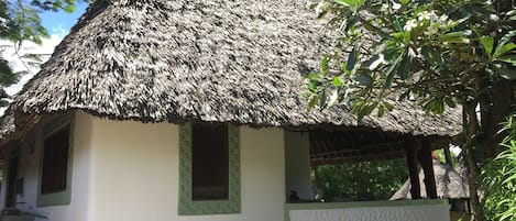 The Cottage side view with traditional laundry area 