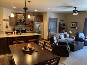 Dining room table seats 6, with 2 extra stools at the counter bar. 