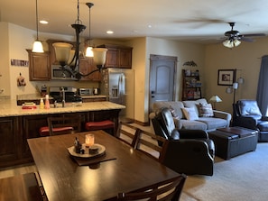 Dining room table seats 6, with 2 extra stools at the counter bar. 