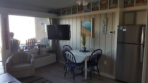Open concept living, dining, and kitchen area.