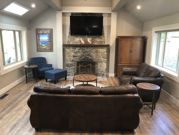 Cozy mountain themed great room with modern rustic details and a 69" Smart TV