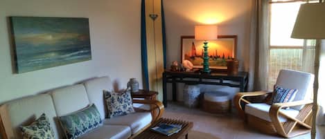 Sunny and Bright front room, with Vintage Rattan furniture, and travertine floor