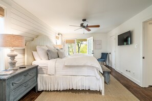 Serene master bedroom on the first floor that opens onto back porch. 