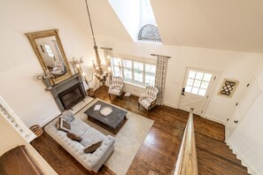 View of the living room from the upstairs loft. 