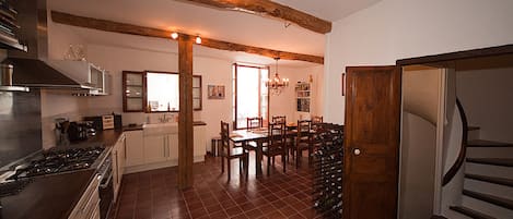 Kitchen and dining area; with doors to patio. Original 19th century doors.