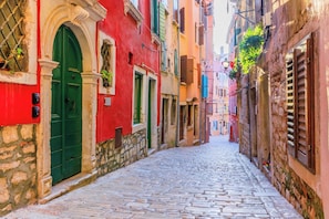 The picturesque medieval street in Rovinj where Arco Vecchio is located.