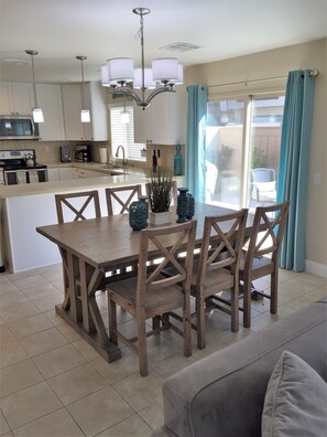 dining area with a slider that heads out to the patio.