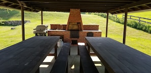 Brick oven, propane grill, long tables