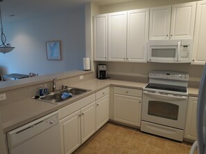 Large, roomy kitchen.  Dishwasher, range, microwave.