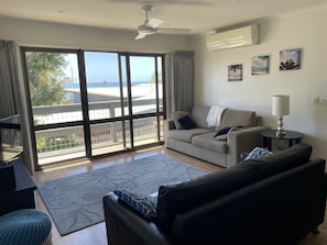 Sliding doors with fly screen to the front deck with a view