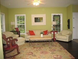 Spacious Open Family Room with oodles of nature sunlight, comfy leather seating!  