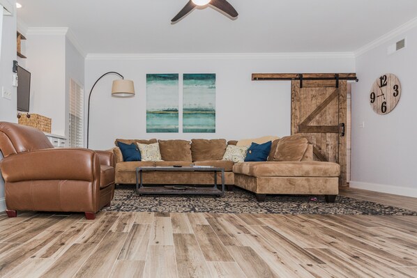 Custom Barn Door and Large Sectional to relax