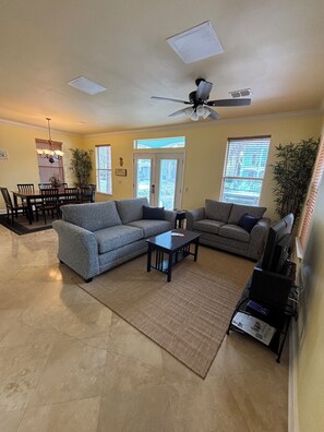 The open concept living and dining area is great for mingling with your group.