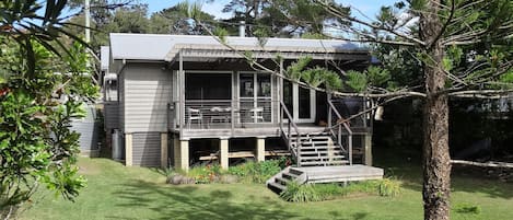 Cottage opens onto vast green space out towards beach