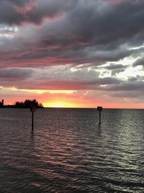 Sunset from Sam's Beach bar.  Stake out your seat along the rail by the water!