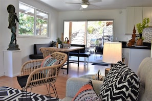 Living Area leads to large outdoor lanai and pergola.
