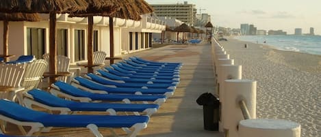 3 ocean front pools w lounge chairs palapas