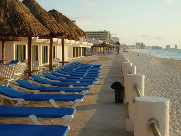 3 ocean front pools w lounge chairs palapas