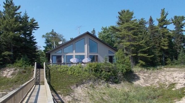 Our lovely 4 bedroom home viewed from our 200 feet of sandy beach 
