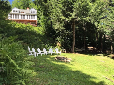 Lakefront lawn area with fire-pit