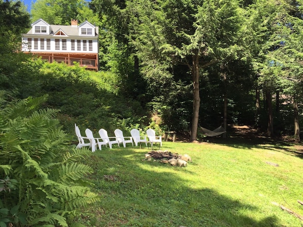 Lakefront lawn area with fire-pit 